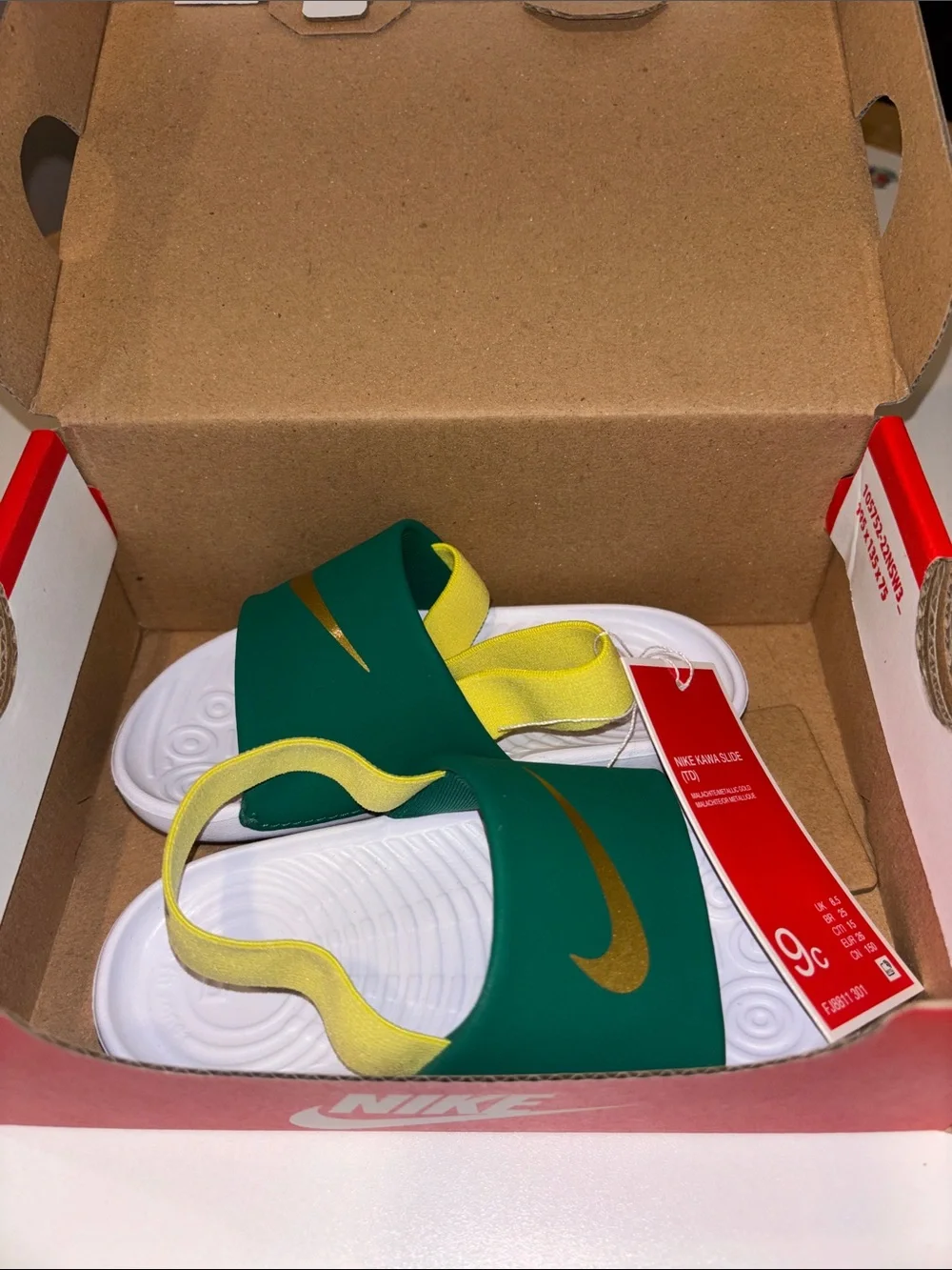 Nike Kids Slide Sandals in Green with Gold Swoosh and White Footbed